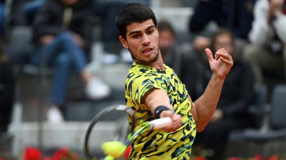 Alcaraz marks world number one spot with victory in soaking Rome