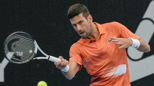 Djokovic recovers from shaky start to reach Adelaide quarters 