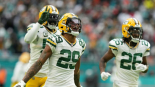 Packers defeat Miami to boost NFL playoffs hopes  