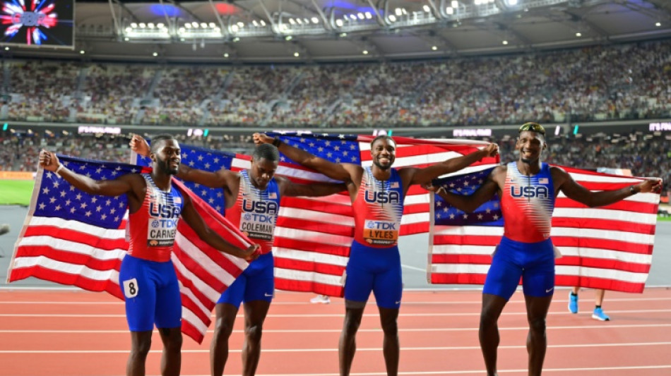 Lyles wins third world gold after anchoring US relay to victory