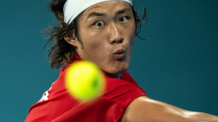 Zhang fights back to win Asian Games tennis gold