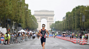 Britain's Alex Yee goes in Seine to win Olympic triathlon test event