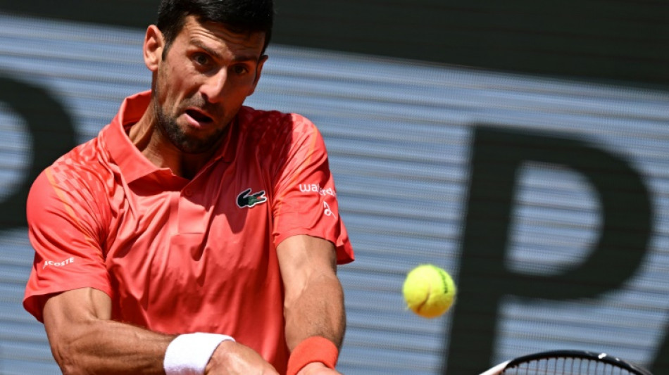 Djokovic battles into French Open second round, Alcaraz through