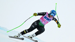 Curtoni beats the fog to win shortened downhill 